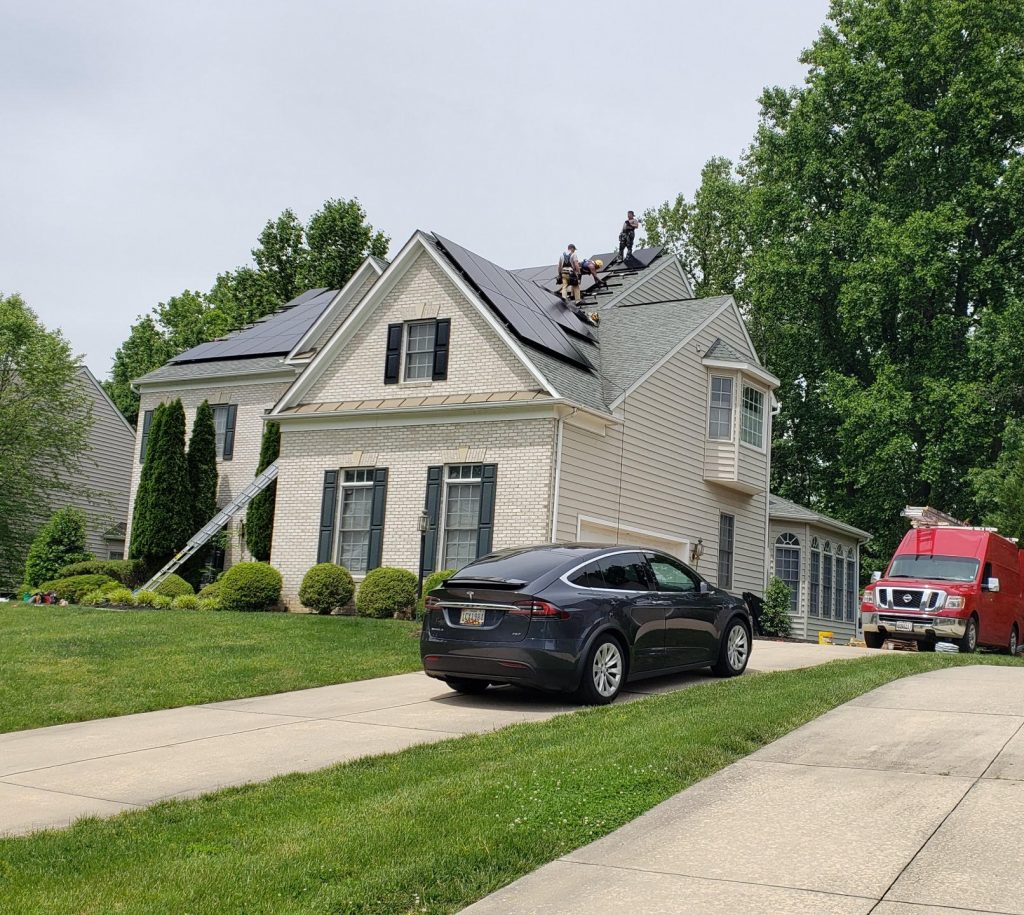 residential solar panel installation on roof of home.