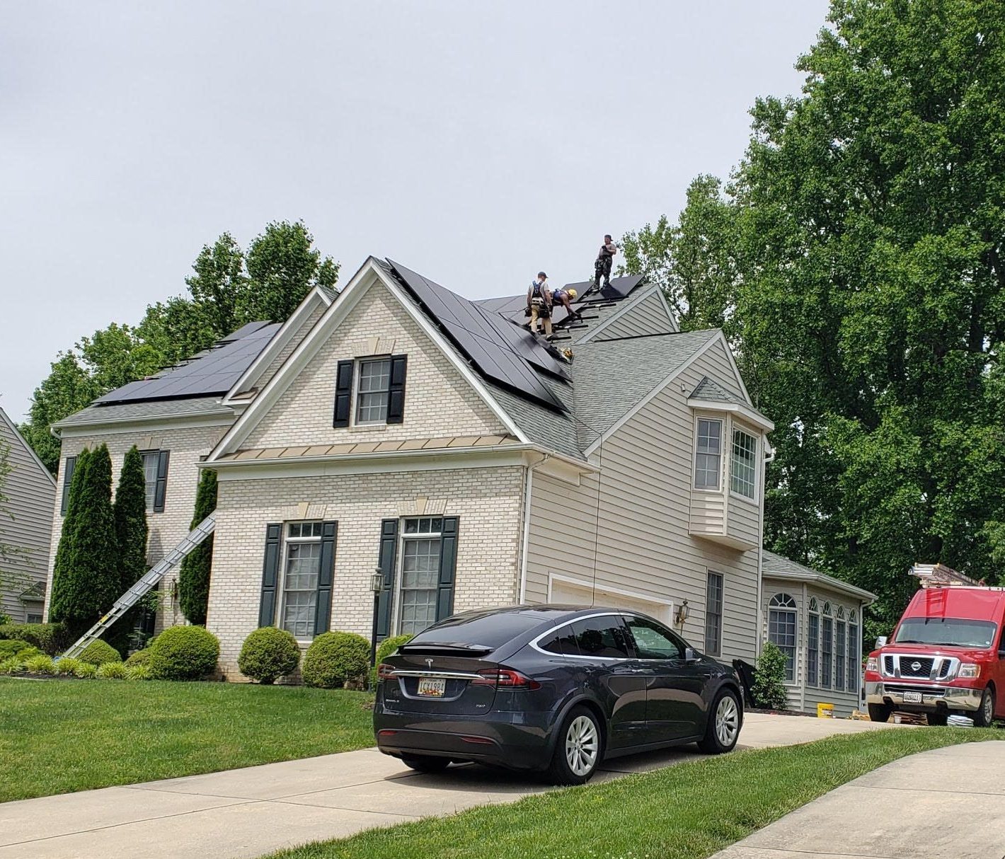 residential solar panel installation on roof of home.