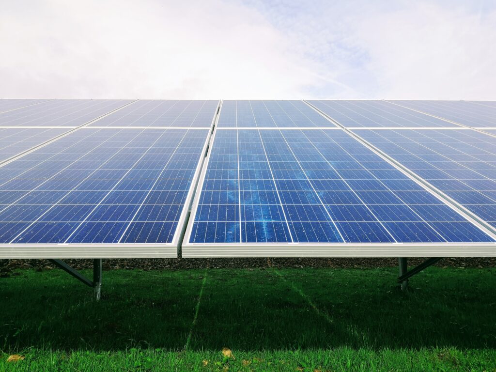 Ground mounted solar panels in a grass field